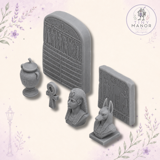 1:12 scale Egyptian Collection featuring six resin printed Ancient Egypt miniatures including Anubis, pharaoh bust, urn, ankh and carved stone tablets, supplied unpainted.