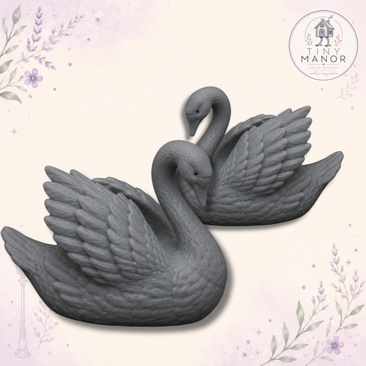 Matching pair of unpainted grey resin swans for wedding cake toppers, doll's houses and miniature displays.